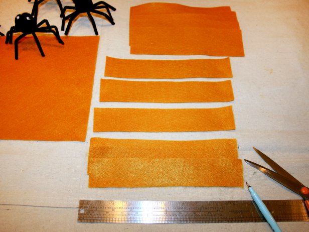 Fun Halloween napkin rings can be made from orange felt.