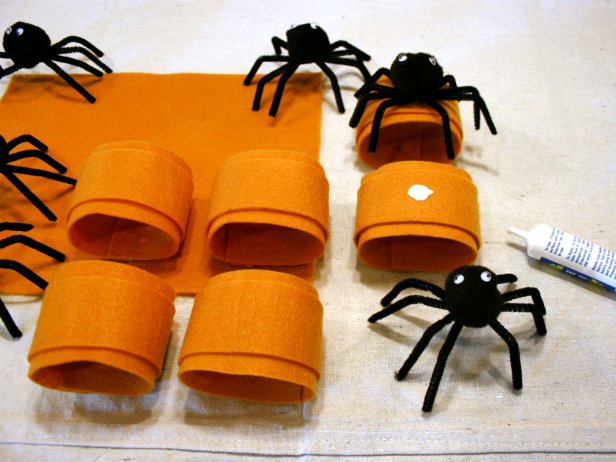 Attach spooky spiders to fun Halloween themed napkin rings.