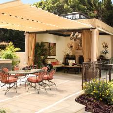 Outdoor Dining Area with Stylish Fabric Pergola and Adjacent Living Space