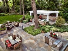 Stone Tile Patio With Seating Areas and Hot Tub