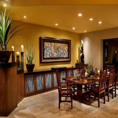 Yellow Transitional Dining Room With African Accents