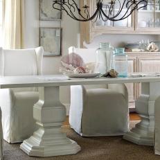 White Coastal Dining Room With White Farmhouse Table