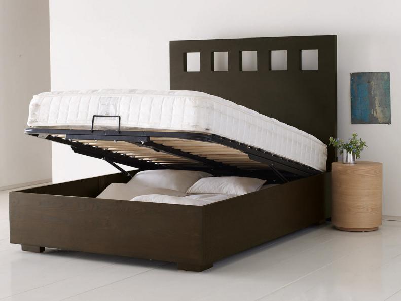 The bed's mattress platform raises up to provide extra storage.