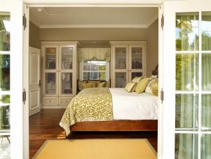 Bedroom With Glass Front Armoires