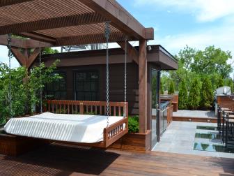 Urban Outdoor Patio Space With Pergola and Swinging Daybed