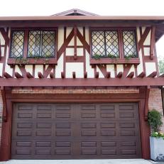 Tudor-Style Home With Window Boxes and Wood Accents