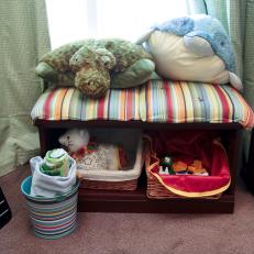 Toy Storage Bench Topped With Colorful Striped Pillows