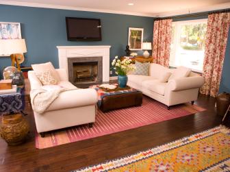 Blue Living Room With Red Curtains and White Couches