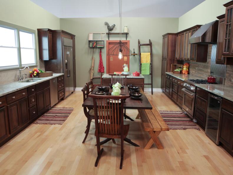 Pale Green Farmhouse Kitchen With Wood Bench and Brown Cabinets