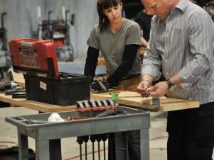 Mike Holmes Working on Project with Contestant