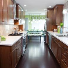 Traditional Galley Kitchen with Cabinetry and Dining Area