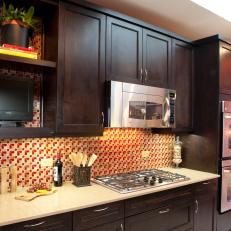 Contemporary Kitchen with Dynamic Tiles and Dark Wood