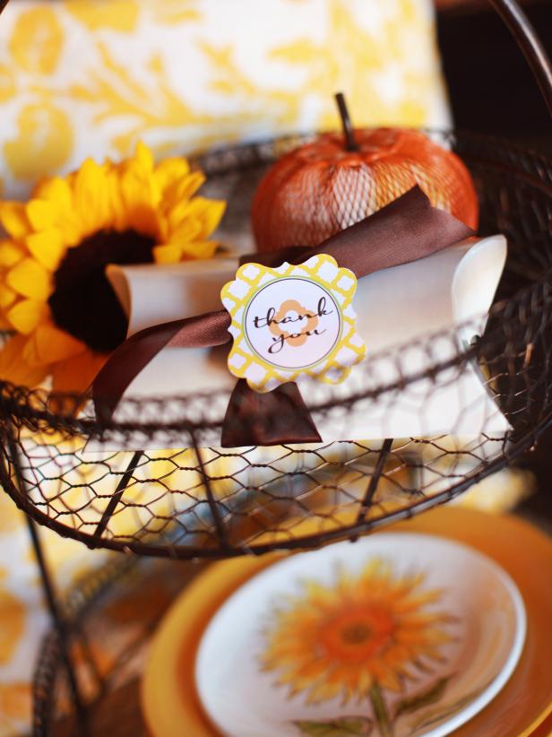 Send guests home with a sweet memory by filling small favor boxes with chocolates, nuts, dried fruit or luxurious fall-scented soaps. Wrap each with thick chocolate brown ribbon and top with a printable favor tag.