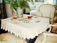 Card tables are convenient to use when entertaining over the holidays, but they can be eyesores.  A simple slipcover that is fitted and washable (not to mention pretty) is the perfect solution.