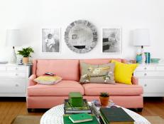Pink Living Room Sofa with Baby Photos Overhead 