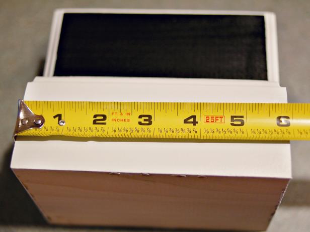 Using ruler or tape measure, find center point on front of base.