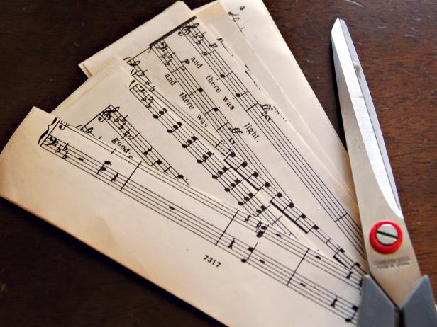 This sheet music has been cut into strips with scissors to make a decorative Christmas tree.
