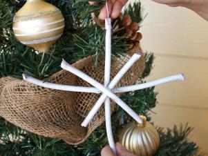 Hanging a Snowflake on a Christmas Tree