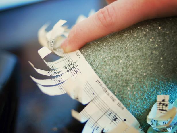This sheet music strip is glued to the bottom edge of a foam Christmas tree.