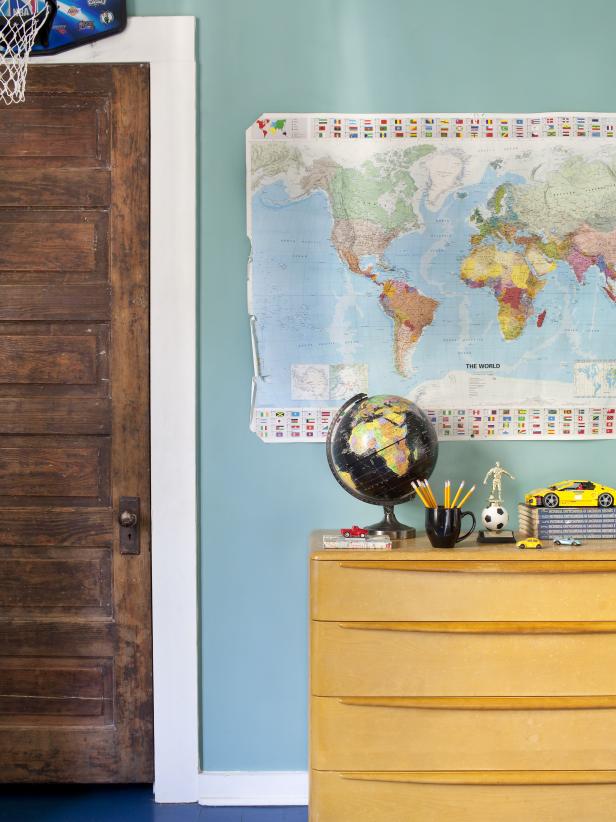 World Map Posted on the Wall and a Globe on the Dresser. 