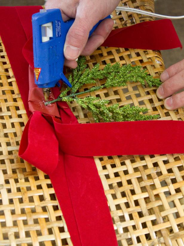 Hot Glue Gun to Flat Evergreen Sprigs on Red Ribbon 
