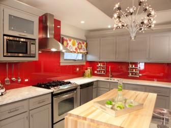 Contemporary Kitchen With Gray Cabinets and Red Backsplash