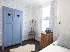 Blue and White Bedroom With Blue Armoire, Toile Wallpaper and Curtains 