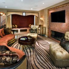 Entertainment Room With Tiled TV Wall, Curvy Sofa and Bold Rug