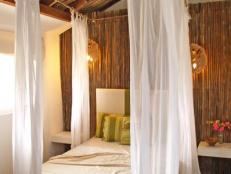 Bedroom With Bamboo Wall and Thatched Ceiling