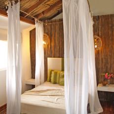 Tropical Bedroom With a Gauzy Canopy Bed