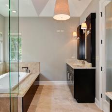 Contemporary Bathroom with Dark Cabinets and Soaking Tub