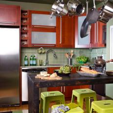 Transitional Green Kitchen With Pot Rack and Stools