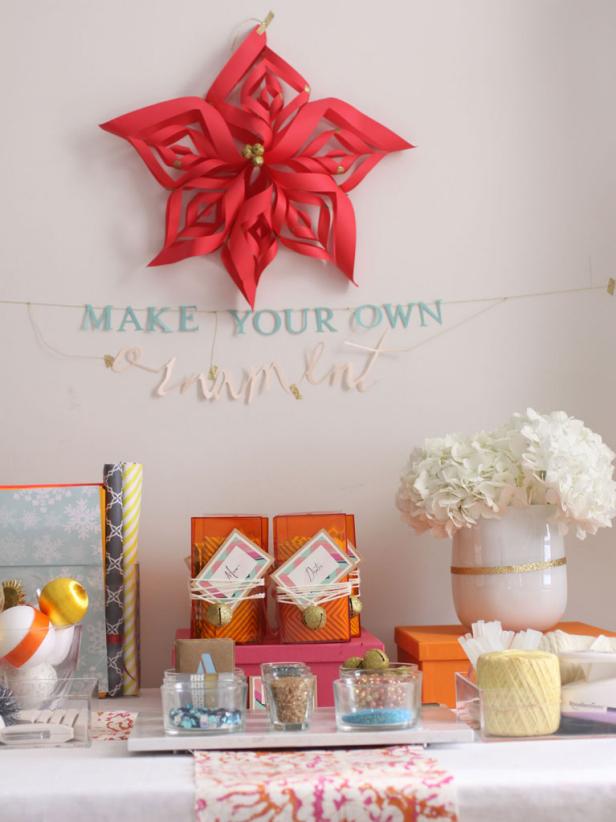DIY Ornament Station Table With Paper Poinsettia at Holiday Party