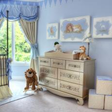 Sweet Blue Nursery With Gold Changing Table