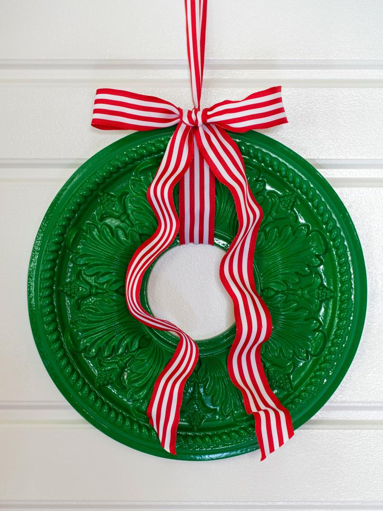 Green Ceiling Medallion Wreath With Red and White Striped Ribbon