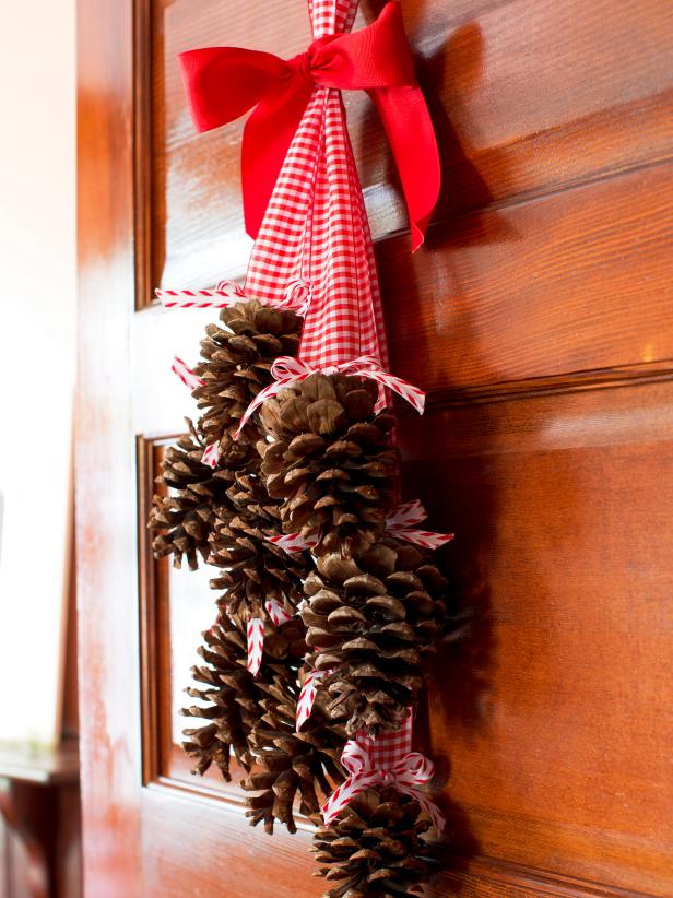 Hanging Pine Cone Bundle With Red and White Ribbon