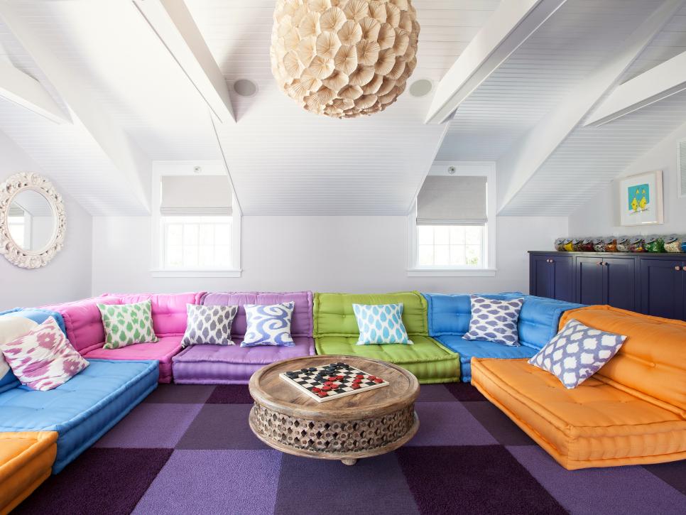 Colorful Modern Game Room With Wraparound Sofa And Purple