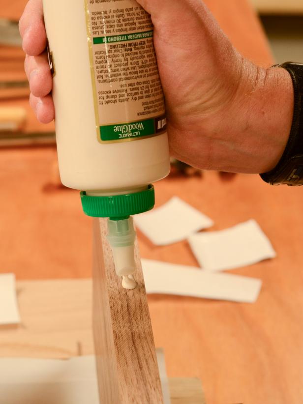 Apply a bead of glue along one side of center piece of wood.