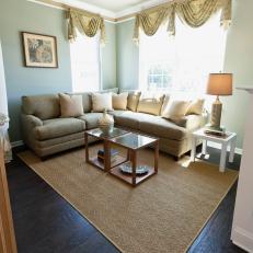 Tan and Green Living Room With Custom Furnishings