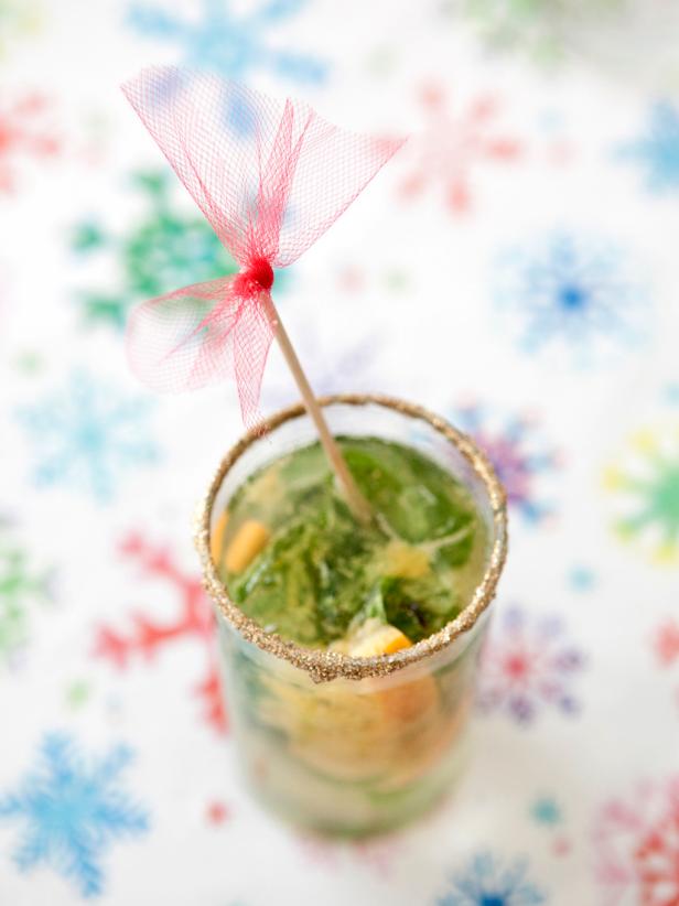 The best part of this drink is the edible glitter rim. Sweet citrus and tasty mint make an unexpectedly delicious pair in this festive party cocktail.