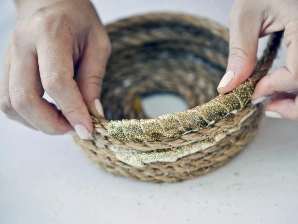 To create the basket, add a few more rows of rope, a section of gold ribbon, and two more rows of rope. Keep adding rows of rope if you’d prefer a taller basket.