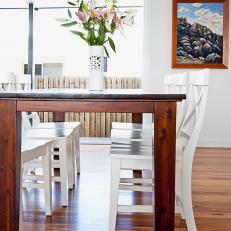 Coastal Dining Room With Hardwood Dining Table