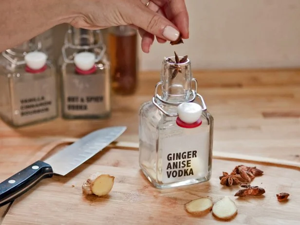 For 7-ounce bottles of infused liquor, 3 anise pods, 1 tablespoon slivered ginger, 7 ounces vodka. Add the ingredients to each bottle, and then fill the bottle with vodka or bourbon.