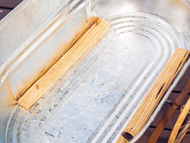 Pine Lumber Strips in Metal Tub to Secure Wheels