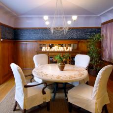 Traditional Dining Room With Wood-Paneled Walls