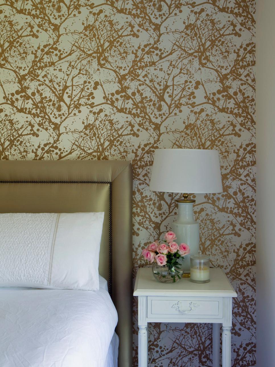 Graphic Gold Wallpaper and Metallic Headboard in Contemporary Bedroom