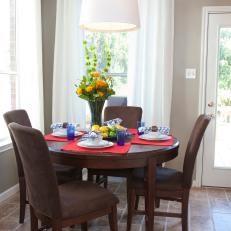 Dark Wood Country Dining Table Against Gray Walls