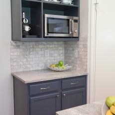Open Shelving Houses Microwave in Neutral Kitchen