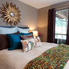 Transitional Bedroom With Multicolored Throw and Pillows