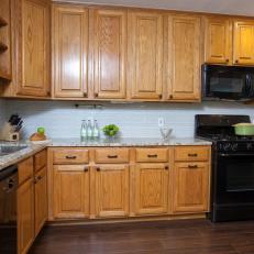 Kitchen With Black Appliances and Granite Countertops